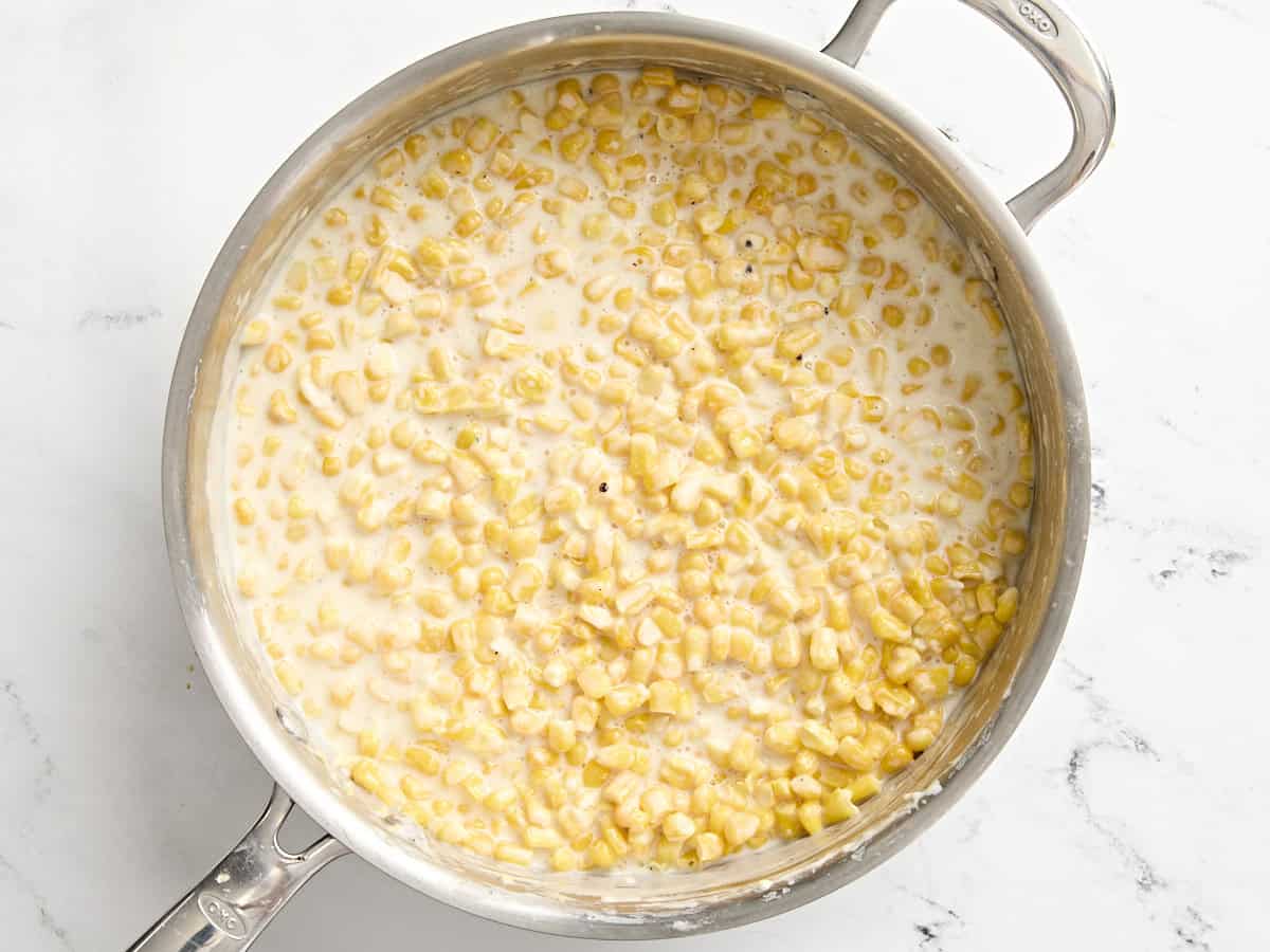 Creamed corn in a saucepan.