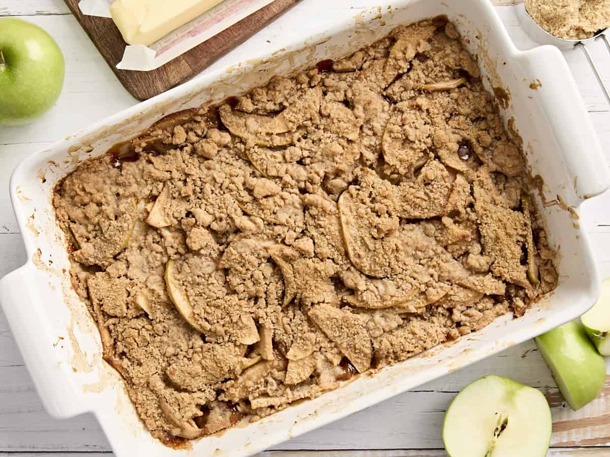 Overhead view of apple crumble in a rectangular baking dish.