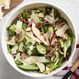 Overhead view of pear celery pecan salad in a serving bowl.