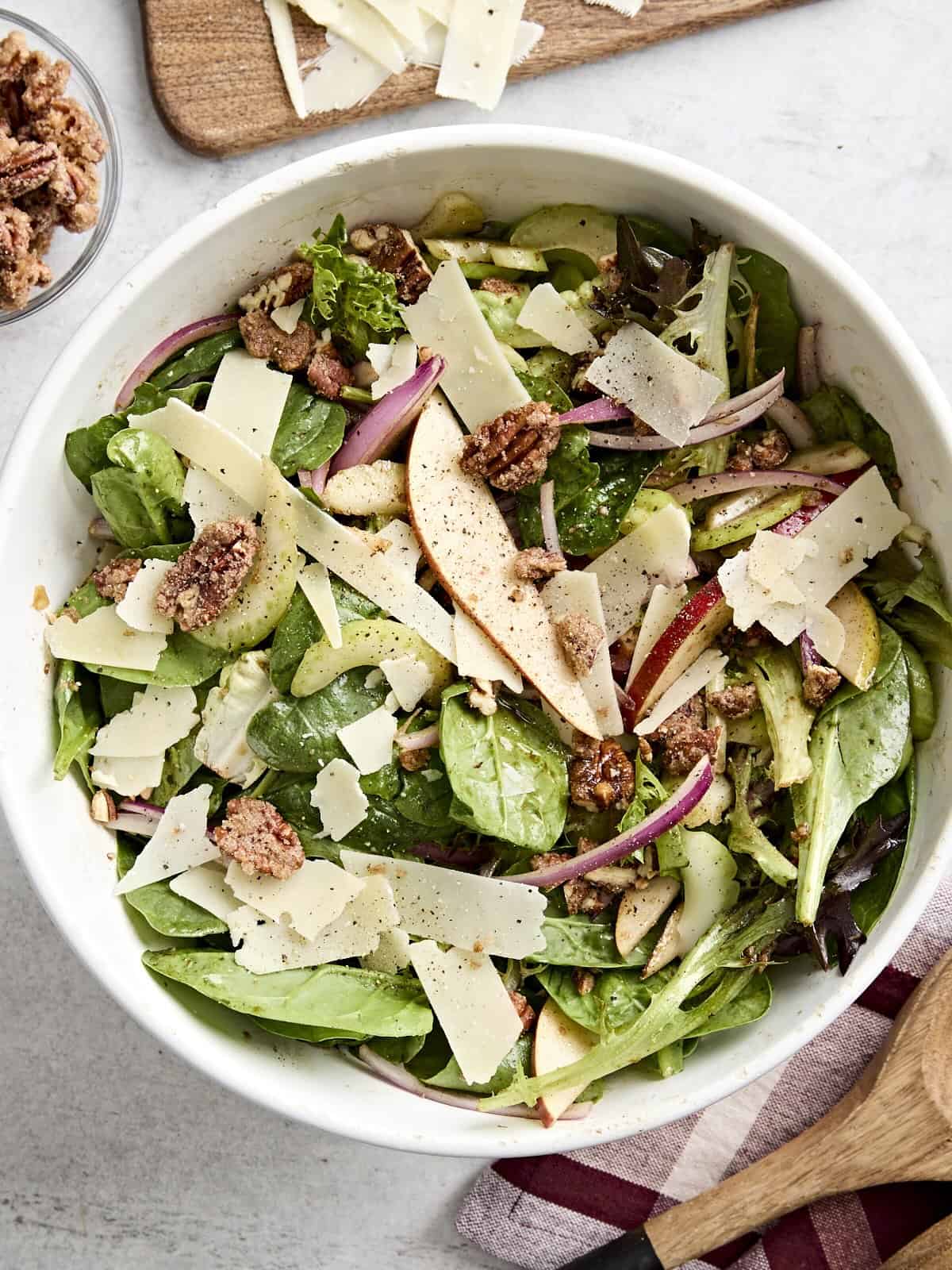 Overhead view of pear celery pecan salad in a serving bowl.