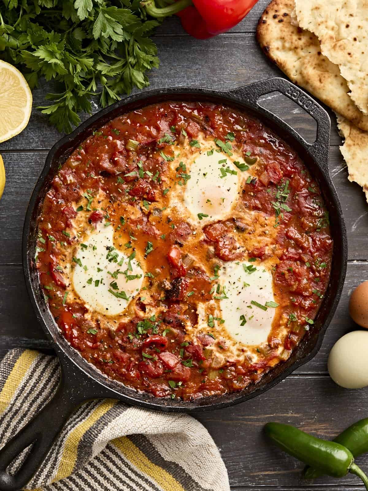 Overhead view of shakshuka in a cast iron skillet.