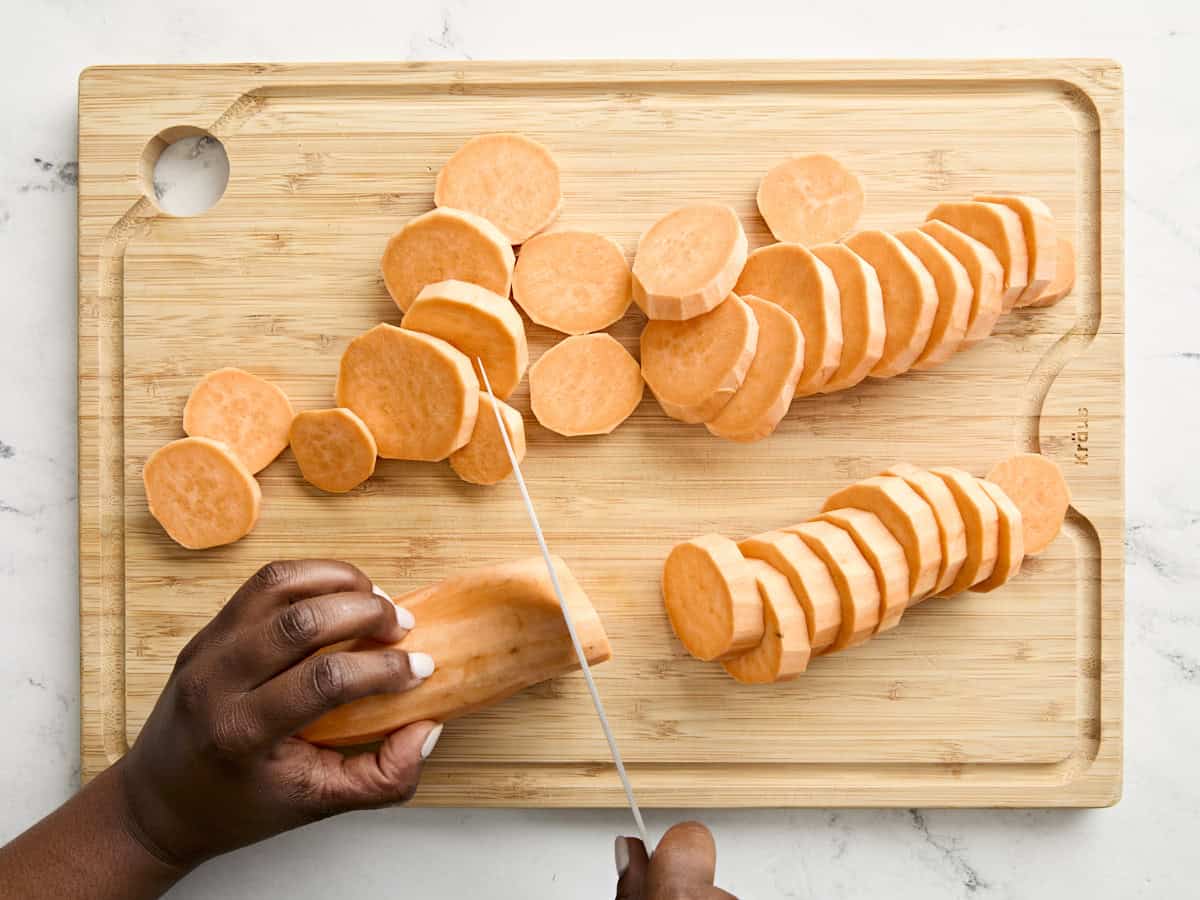 Chopped sweet potatoes on a cutting board.