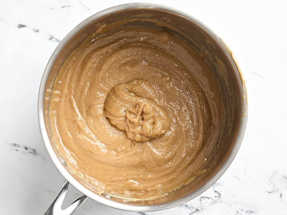 Melted peanut butter and sugar in a sauce pan.