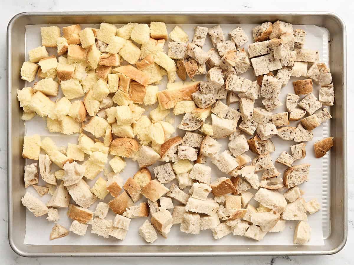 Bread cubes on a baking tray.