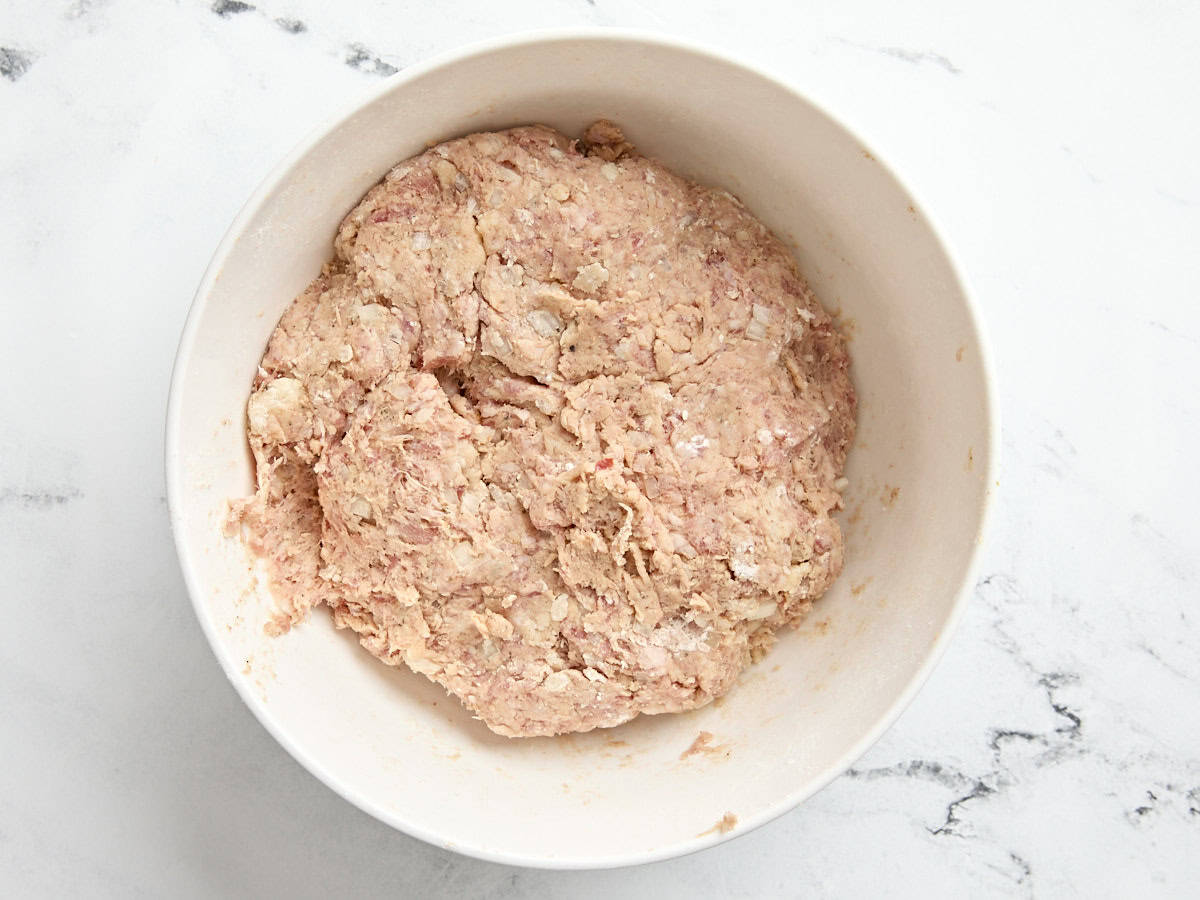 Sausage ball meat mixture in a mixing bowl.