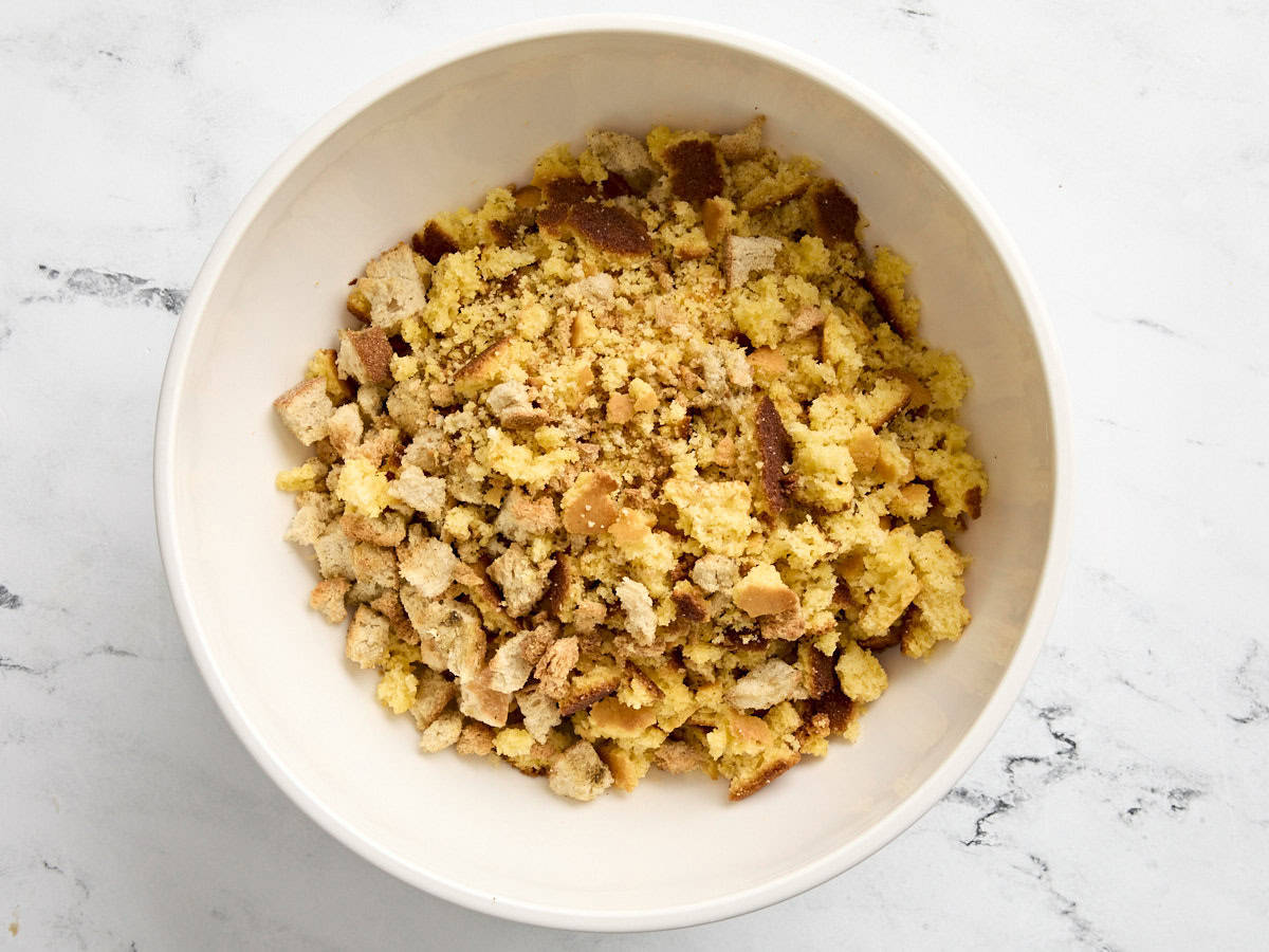 Dried cornbread and bread crumbs added to a large bowl.