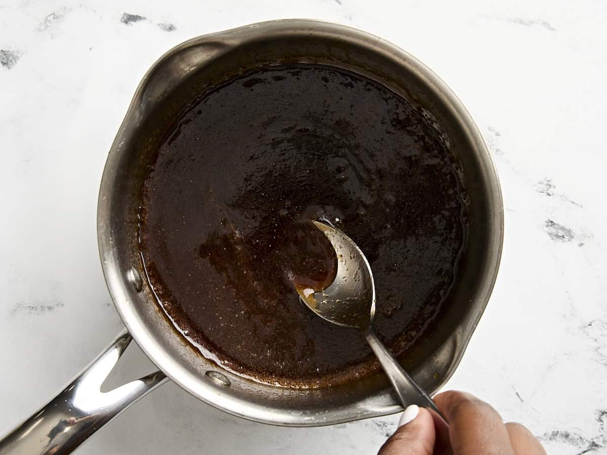 Reducing sugar glaze in a small pot.