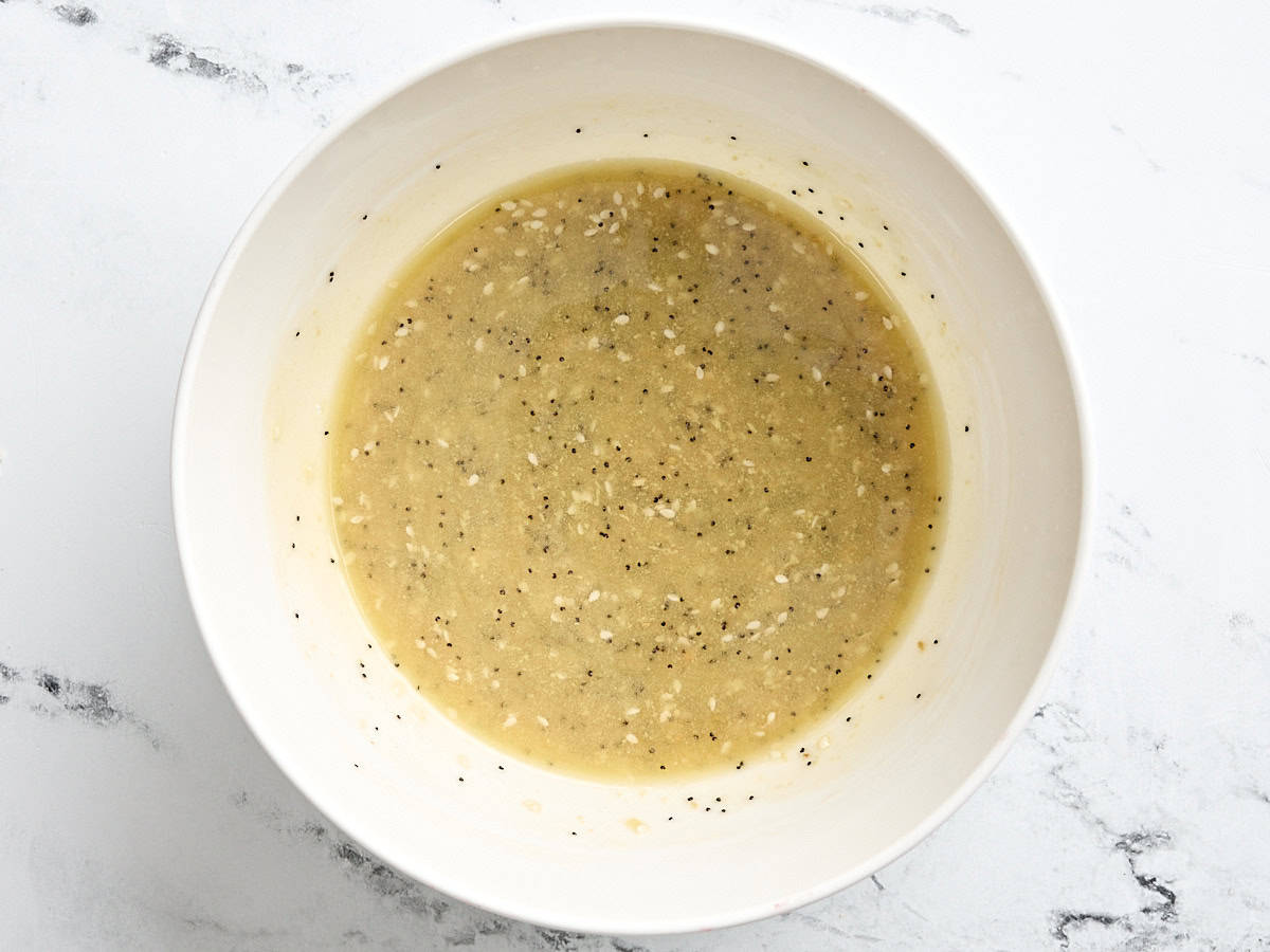 Melted butter and seasonings in a mixing bowl.