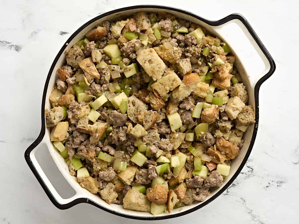 Sausage stuffing in a casserole dish before baking.