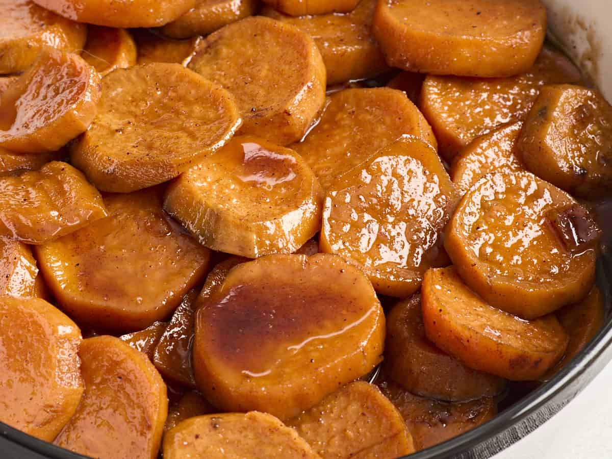 Close up side view of candied yams.