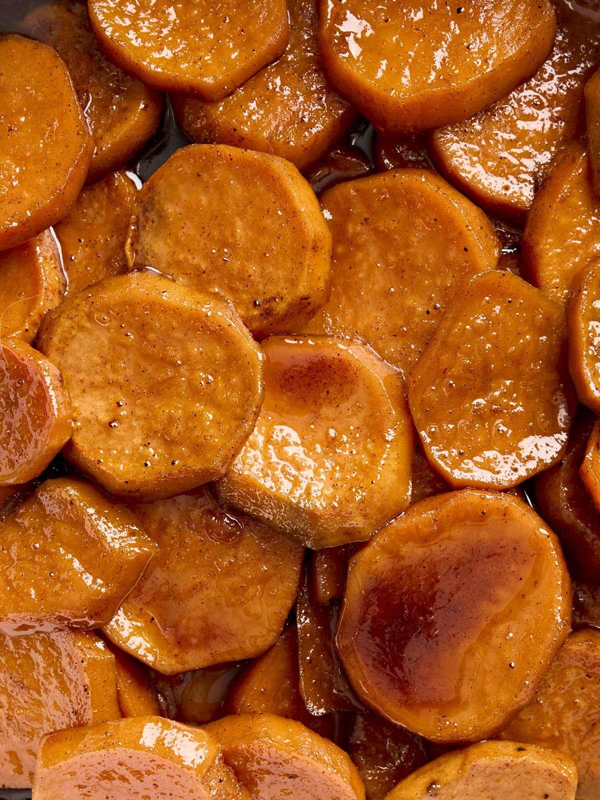 Close up view of candied yams.