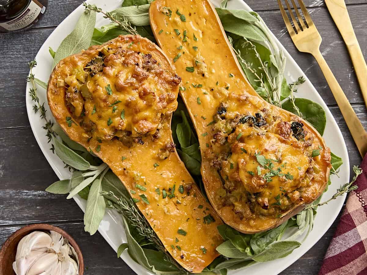 Overhead view of stuffed butternut squash on a plate.