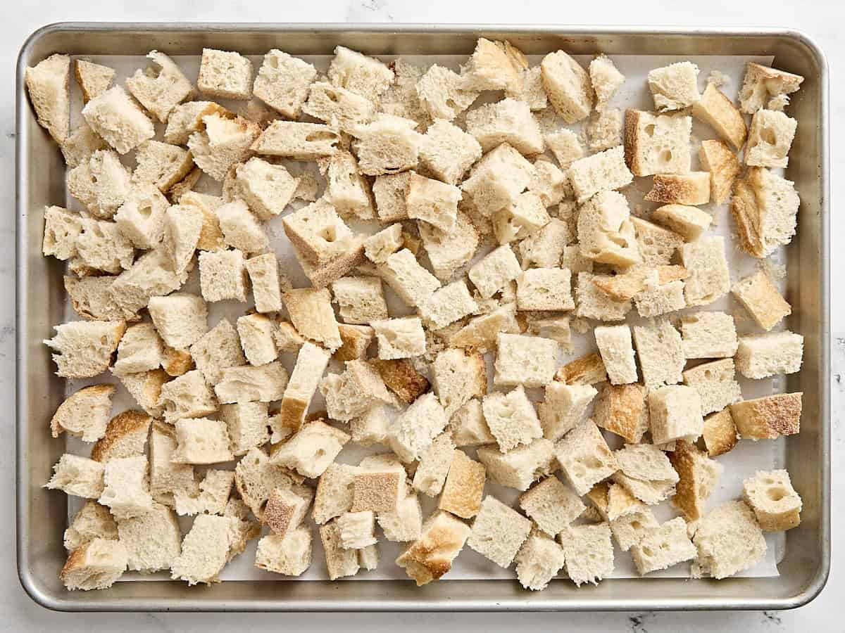 Sourdough bread cubes on a baking tray.