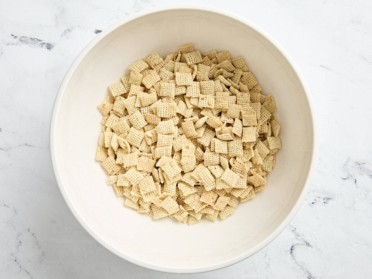 Rice chex cereal in a bowl.