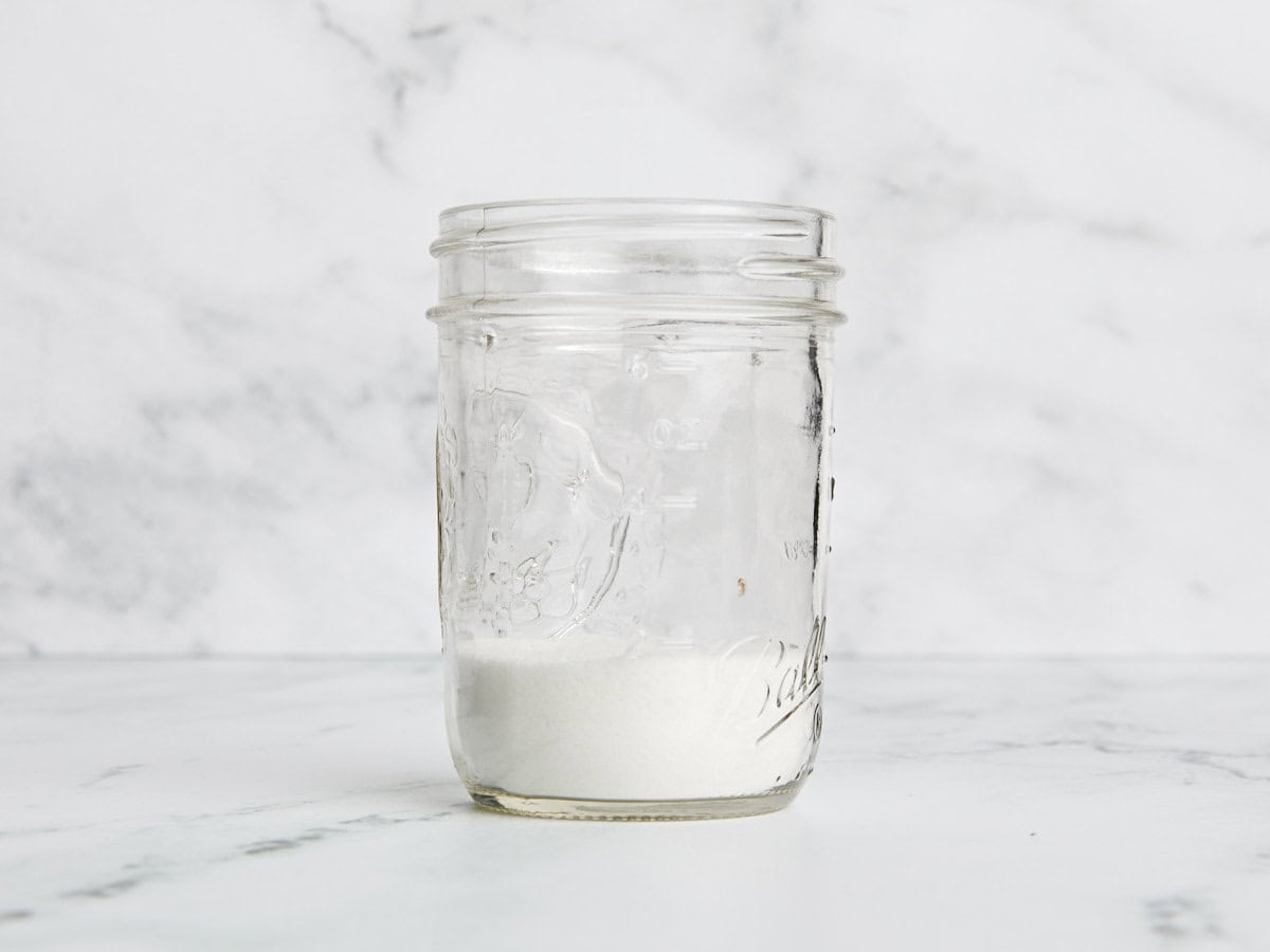 Granulated sugar in a mason jar.