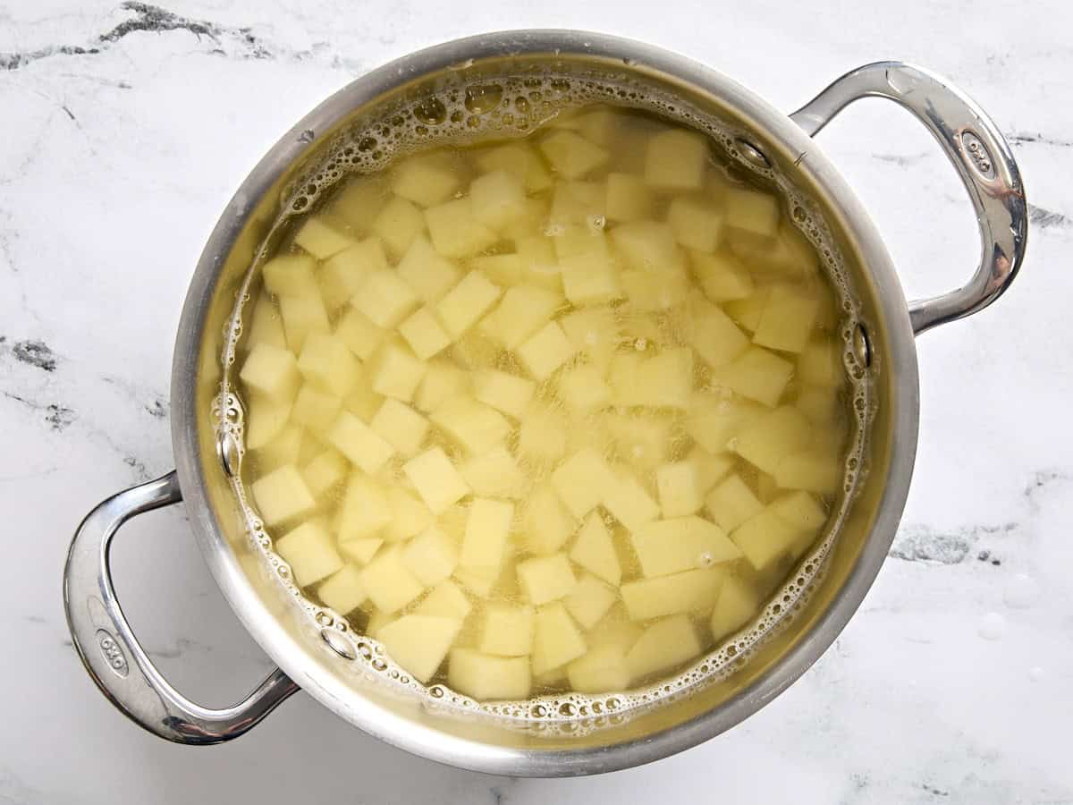 Diced potatoes in a pot of water.