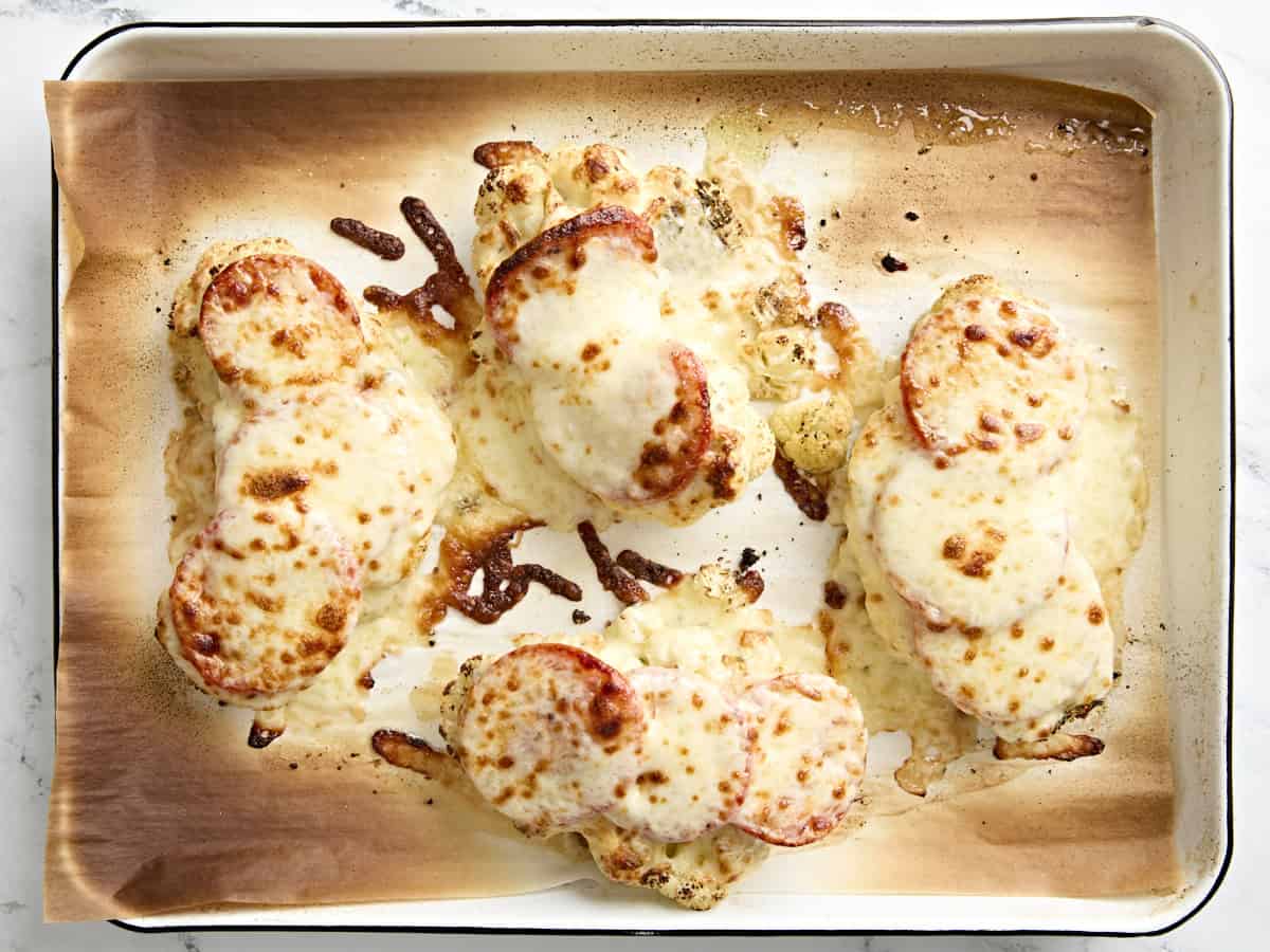 Cauliflower parmesan on a parchment lined baking sheet.