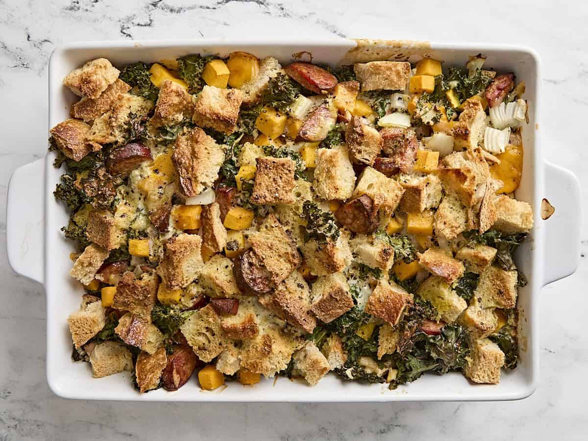 Freshly baked savory bread pudding in a baking dish.