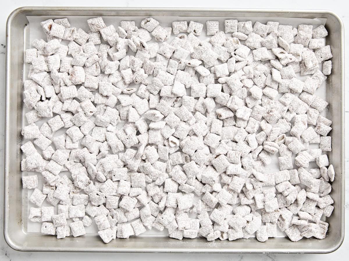 Finished puppy chow on a baking sheet.