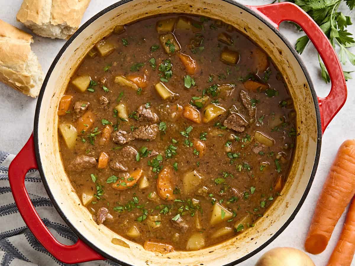 Overhead view of beef stew in a dutch oven.