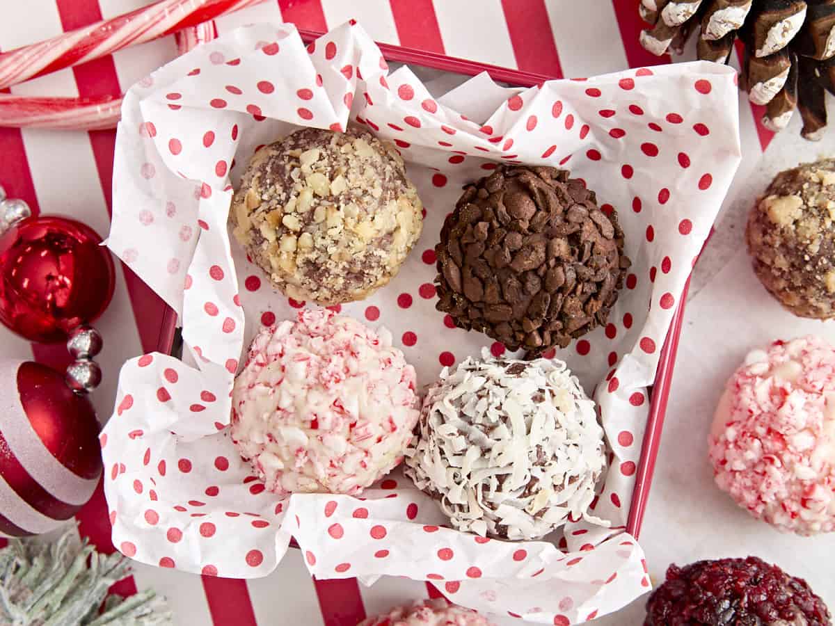 Overhead view of chocolate truffles in a gift box for Christmas.