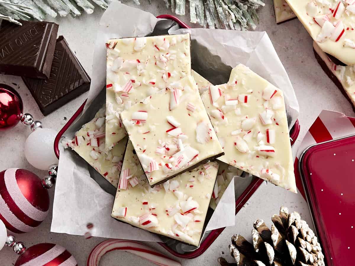 Overhead view of peppermint bark in a gift tin.