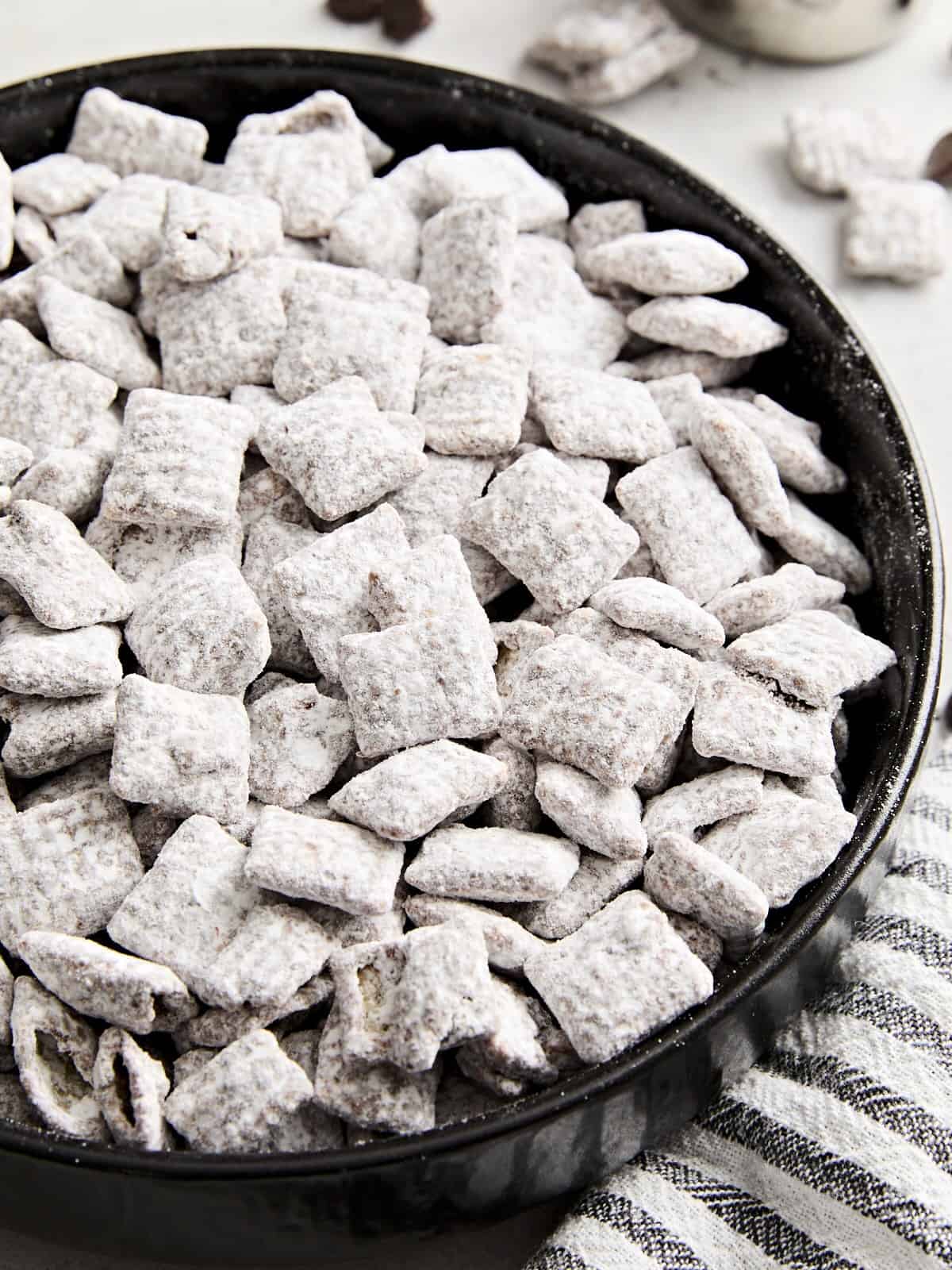 Homemade puppy chow in a bowl.