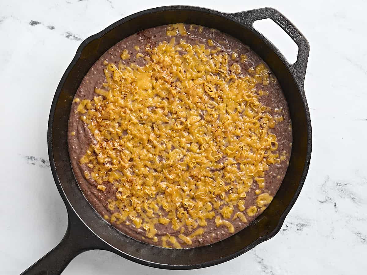 Black bean dip in a cast iron skillet.