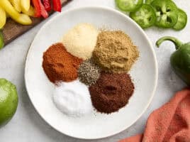 Ingredients for homemade fajita seasoning on a plate.