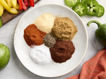 Ingredients for homemade fajita seasoning on a plate.