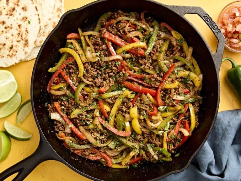 Overhead view of ground beef fajitas filling in a skillet.