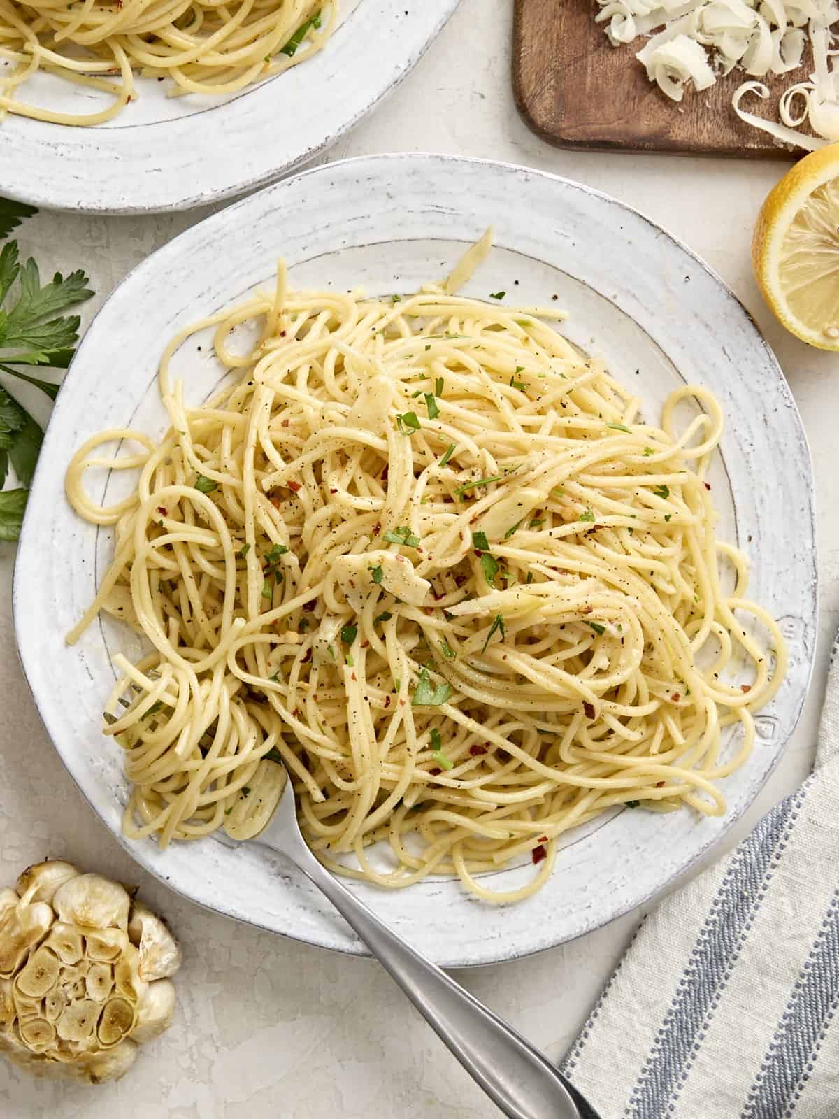 Overhead view of Spaghetti Algio e Olio on a plate with a fork.