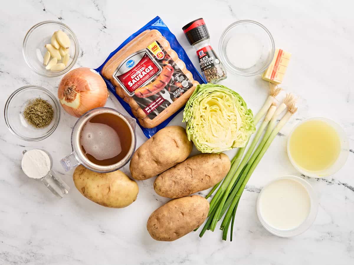 The ingredients to make bangers and mash on a work surface.