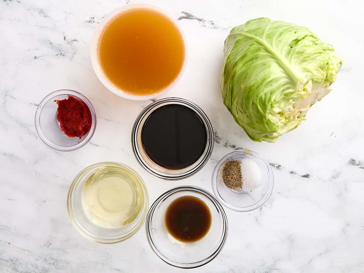 The ingredients needed to make cabbage steaks with a tangy sauce.