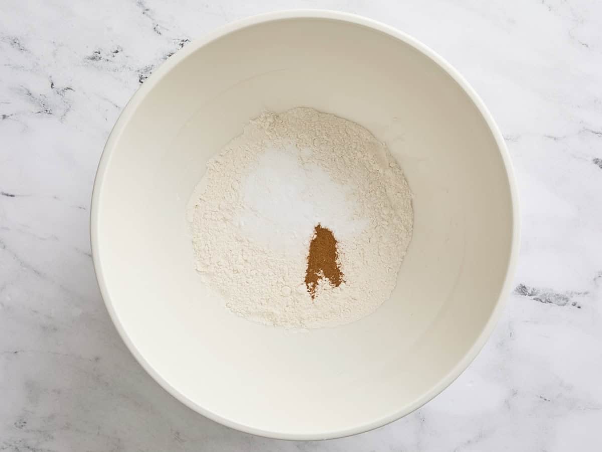 The dry ingredients for blueberry lemon muffins in a bowl.