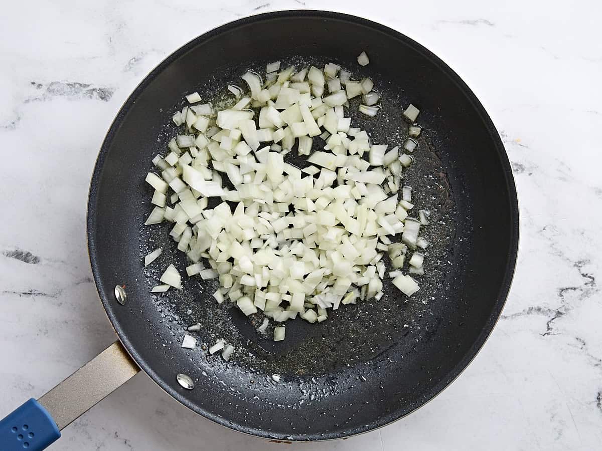 Diced onions in a skillet.