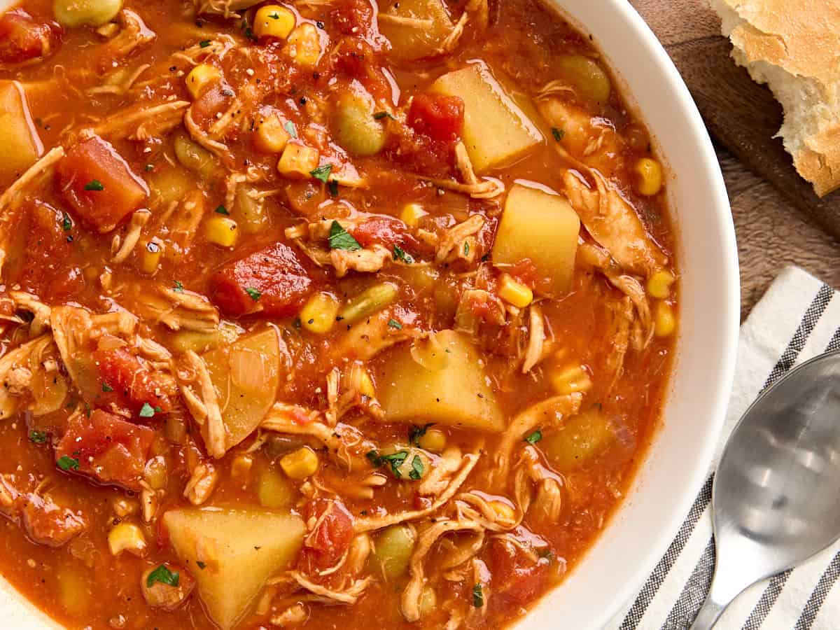 Overhead close up view of a bowl of Brunswick stew.