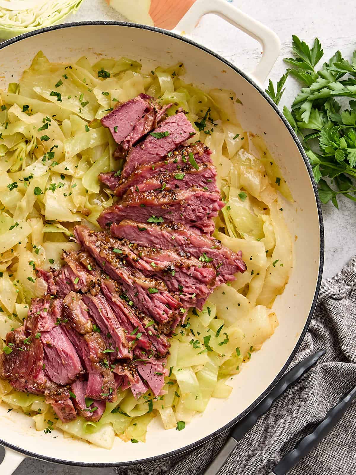 Overhead view of corned beef and cabbage in a skillet.