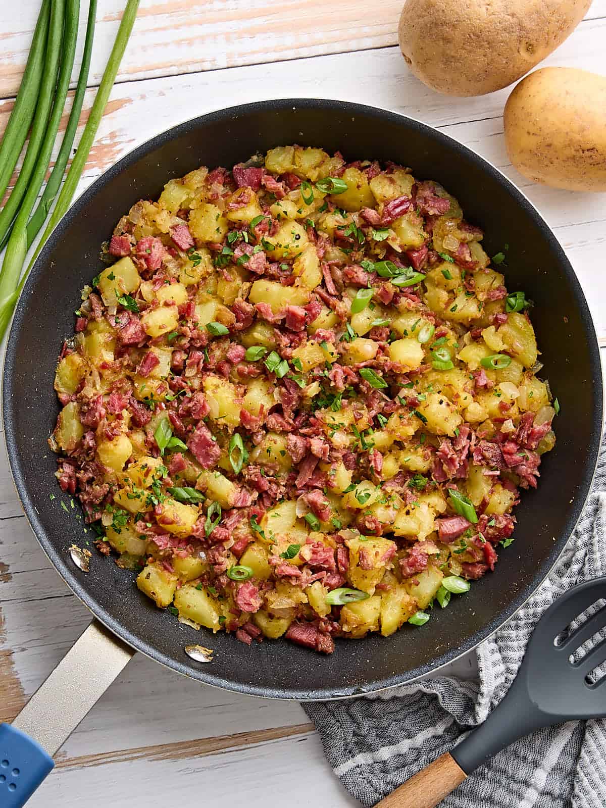 Overhead view of corned beef hash in a skillet.