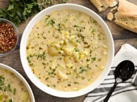 Overhead view of a bowl of potato corn chowder.