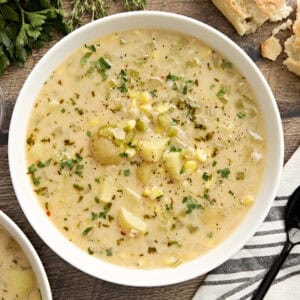 Overhead view of a bowl of potato corn chowder.