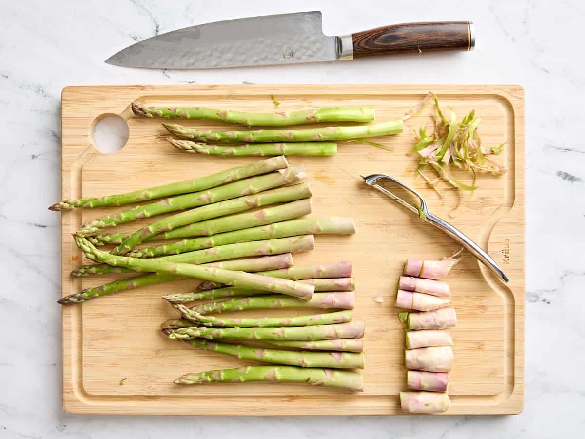 Trimmed asparagus on a cutting board.