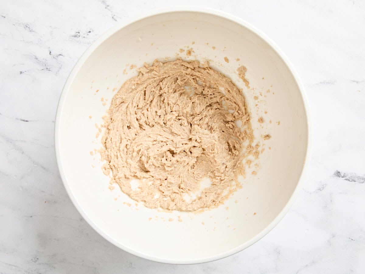 Creamed butter and oil in a bowl.