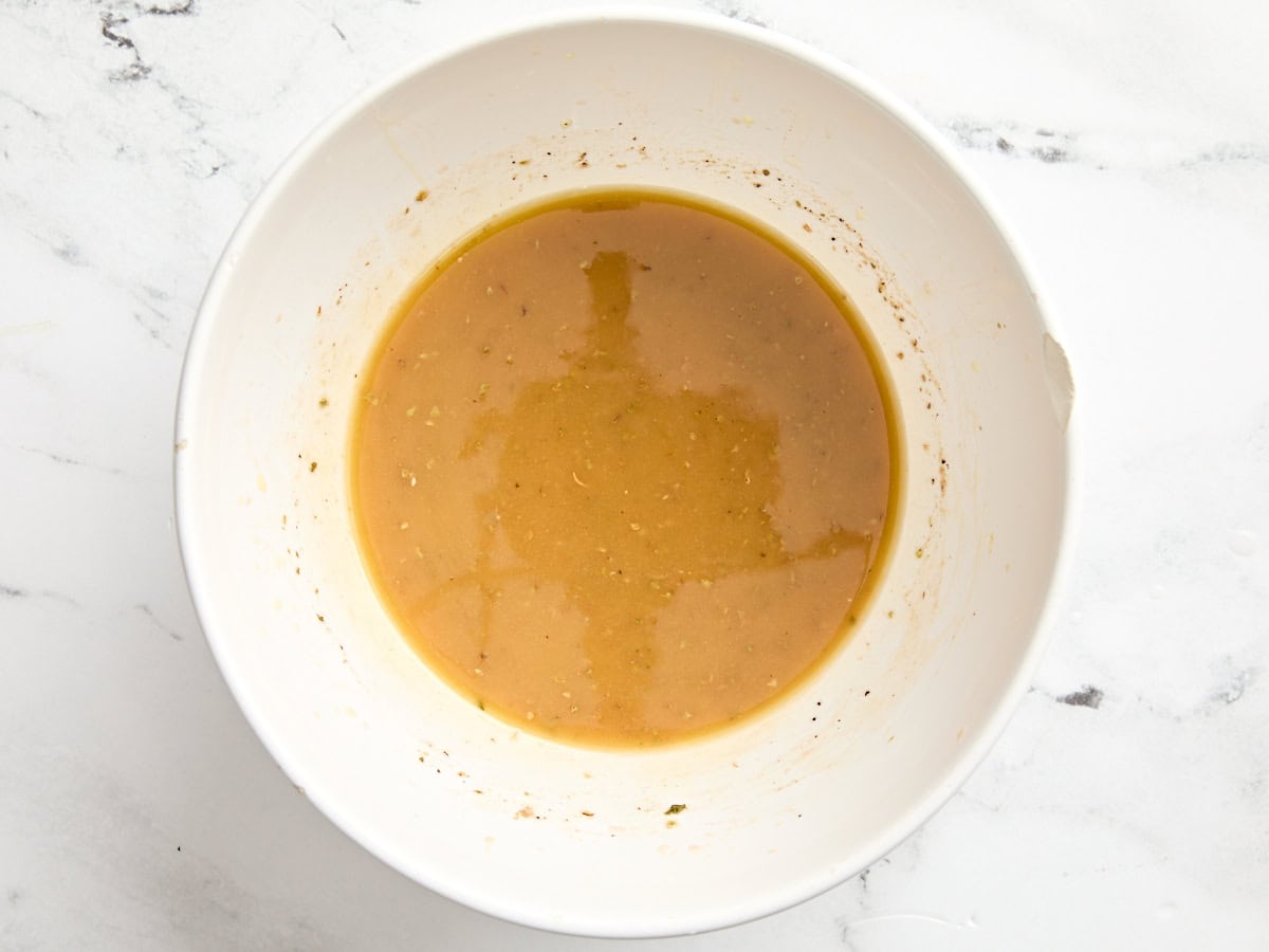 A homemade red wine vinaigrette in a mixing bowl.