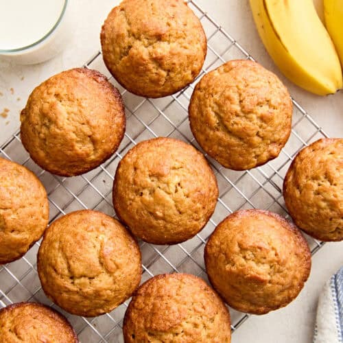 Overhead view of homemade banana muffins on a wire cooling rack.