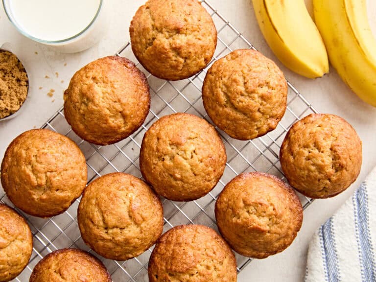 Overhead view of homemade banana muffins on a wire cooling rack.