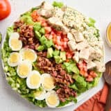 Overhead view of a cobb salad in a serving bowl.