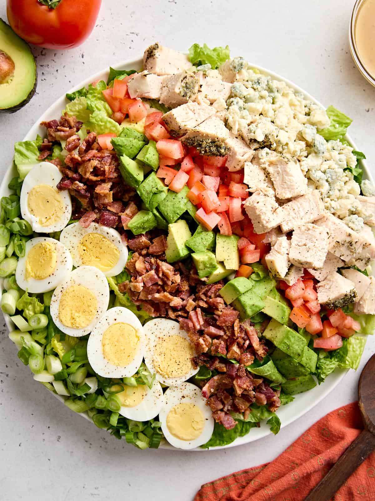 Overhead view of a cobb salad in a serving bowl.