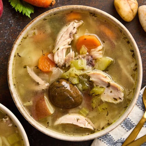 Overhead view of a bowl of homemade stone soup.